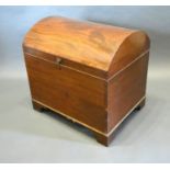 A 19th Century Mahogany Cellarette, the hinged domed top enclosing a sectional interior raised