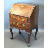 A 19th Century Mahogany Small Bureau, the fall front enclosing a fitted interior above two drawers