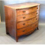 A Regency Mahogany Line Inlaid Bow Fronted Chest of four long drawers with oval brass handles raised