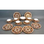 A Royal Crown Derby Tea Service decorated in the Imari palette comprising six cups and saucers,