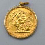 A Queen Elizabeth II Full Gold Sovereign dated 1958 within a 9ct gold pendant mount, 9.3 grams