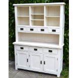 A Painted Dresser, the top with drawers and alcoves, the lower section with three drawers above