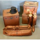 A Pair of Brown Leather Riding Boots together with three travelling trunks, a leather cricket bag