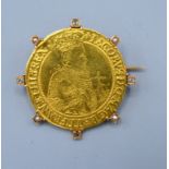 A King James I Gold Unite within a yellow metal brooch mount set with four diamonds and four