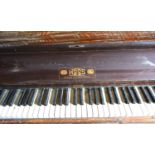 An Upright Piano by Hicks of London with overstrung iron frame