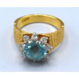 An 18ct Gold Zircon and Diamond Cluster Ring with central Zircon surrounded by diamonds in the