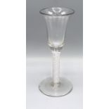 An Early Cordial Glass with opaque twist stem and circular base, 15.5 cms tall