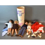 A collection of four Sasha dolls with clothing