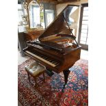 A Burr Walnut Cased Grand Piano by R Gors and Kallmann, Berlin together with a piano stool