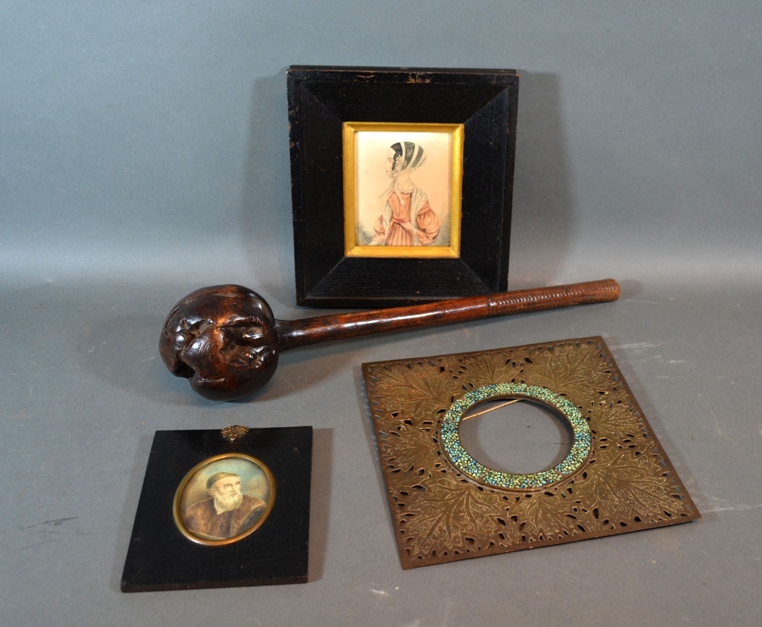 A brass picture frame of square form, together with two portrait miniatures and knob kerrie