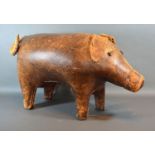 Dimitri Omersa for Liberty of London, a leather footstool in the form of a pig, 64cms long,