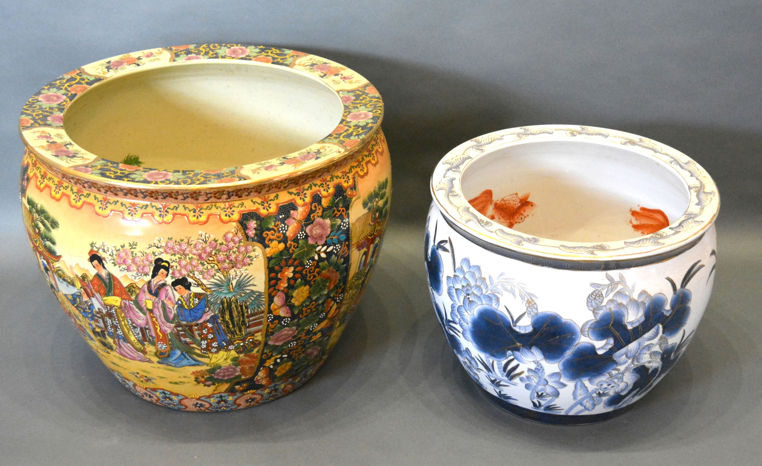 A Chinese porcelain fish bowl together with another similar, 47cms and 37cms diameter