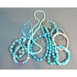 A Turquoise Bead Necklace with silver clasp together with a small collection of other similar bead