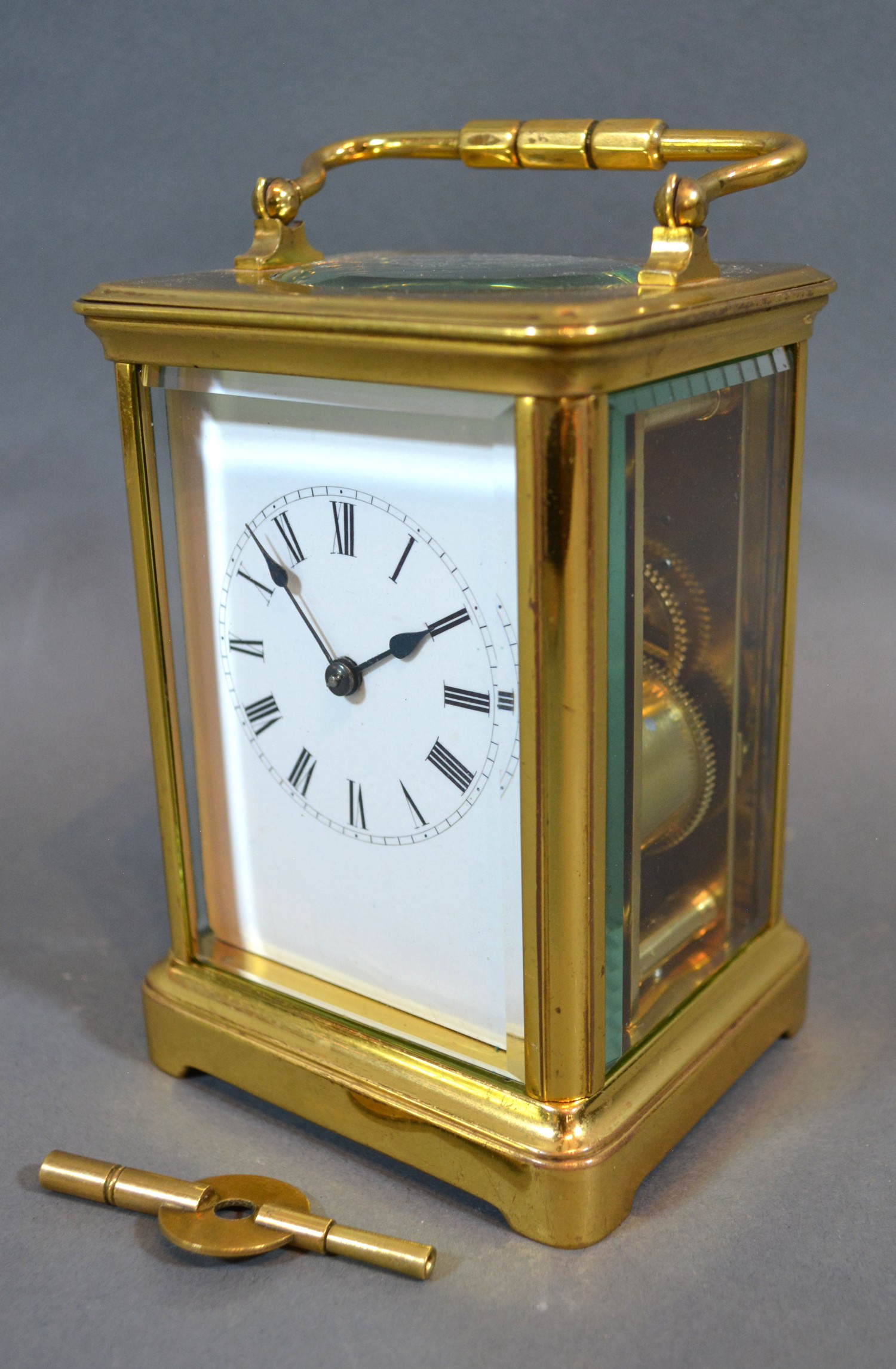 A French Brass Cased Carriage Clock, the enamel dial with Roman numerals and with lever