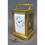 A French Brass Cased Carriage Clock, the enamel dial with Roman numerals and with lever