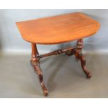 A 19th Century Mahogany Side Table, the cross banded top above twin end turned supports with