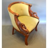 A French Empire Style Mahogany Armchair, the reeded and button upholstered back above scroll arms