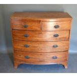 A 19th century mahogany bow fronted chest of two short and three long drawers with oval brass
