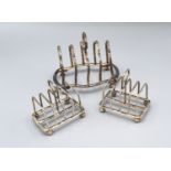 A Pair of Sheffield silver miniature four division toast racks together with another similar