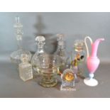 A Waterford glass small clock together with a collection fo glassware to include decanters