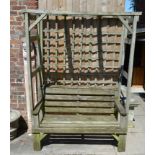 A slatted garden bench with canopy together with a garden folding table and two chairs