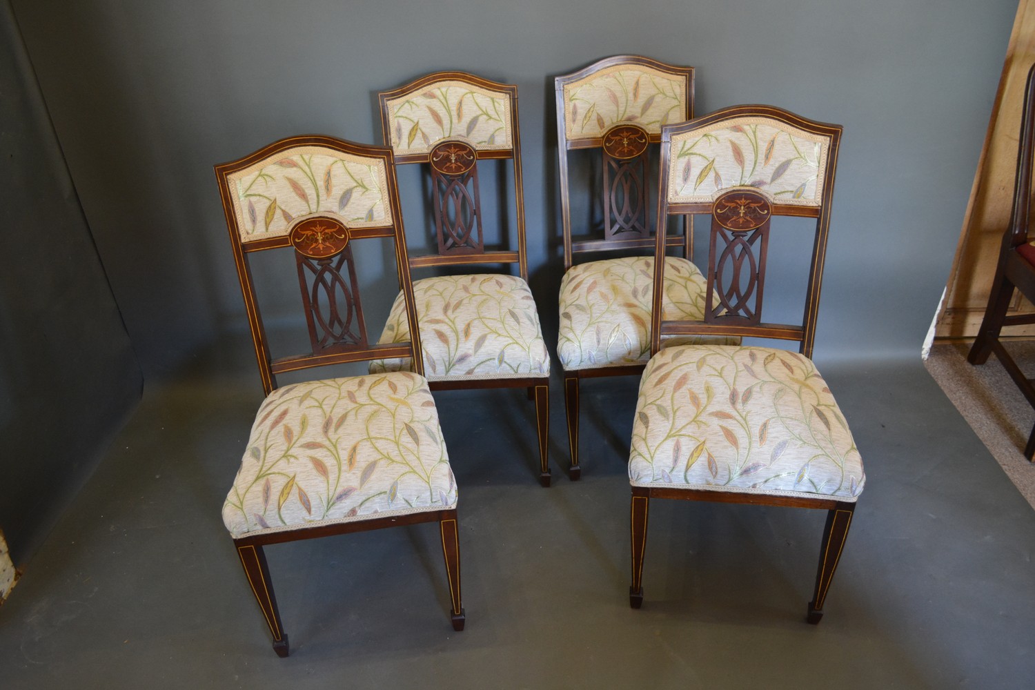 A set of four Edwardian inlaid drawing room chairs together with a harlequin set of seven