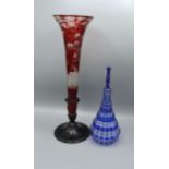 A Bohemian glass vase together with a blue and clear glass decanter