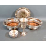 An Indian white metal goblet together with a similar bowl, a pair of silver plated bottle coasters