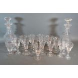 A collection of early drinking glasses and a pair of 19th century decanters