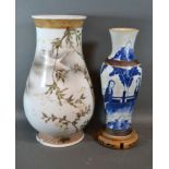 A Japanese porcelain vase decorated birds amongst foliage, 36cms tall together with a crackleware