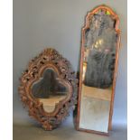 A carved oak wall mirror of pierced scroll for, 80cms x 58cms, together with a walnut dressing