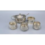 A Chester silver mustard with spoon together with a set of three Sheffield silver napkin rings and