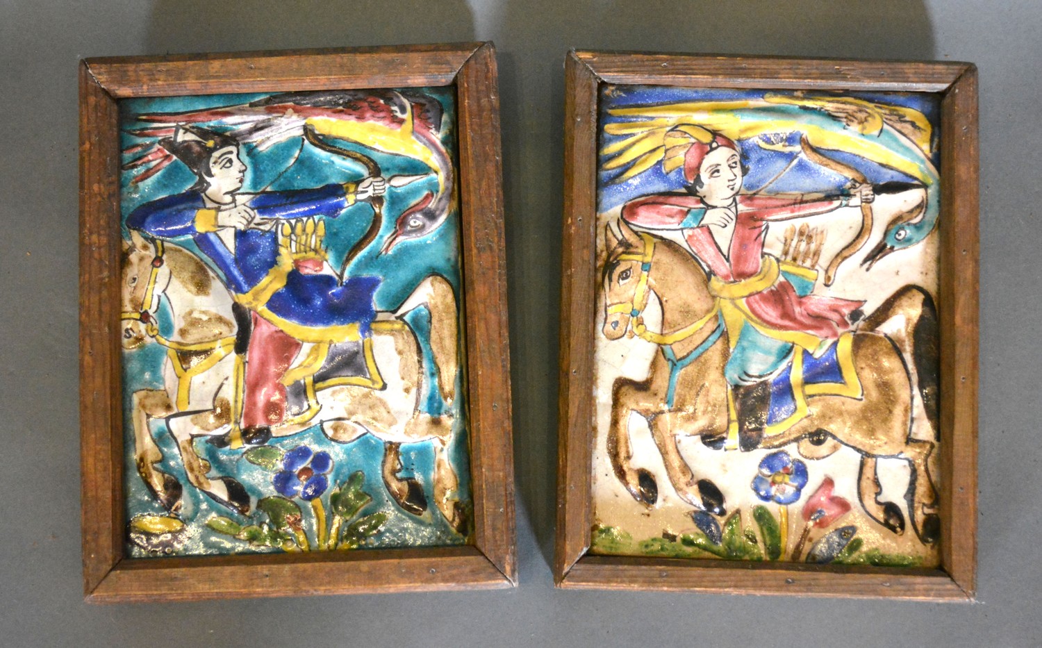 A Pair of 19th Century Persian Majolica Tiles in the form of Bowmen on Horses, 22 x 16 cms