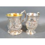 A Victorian silver mug with embossed decoration and silver gilt interior, London 1863, together with