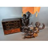 A 20th century painted light fitting in the form of Putti together with a figural table lamp and a