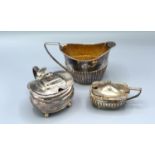 A George III silver mustard London 1798 together with a Chester silver mustard and a Sheffield