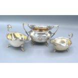 A Birmingham silver two handled sucrier together with two Birmingham silver sauce jugs, 11oz