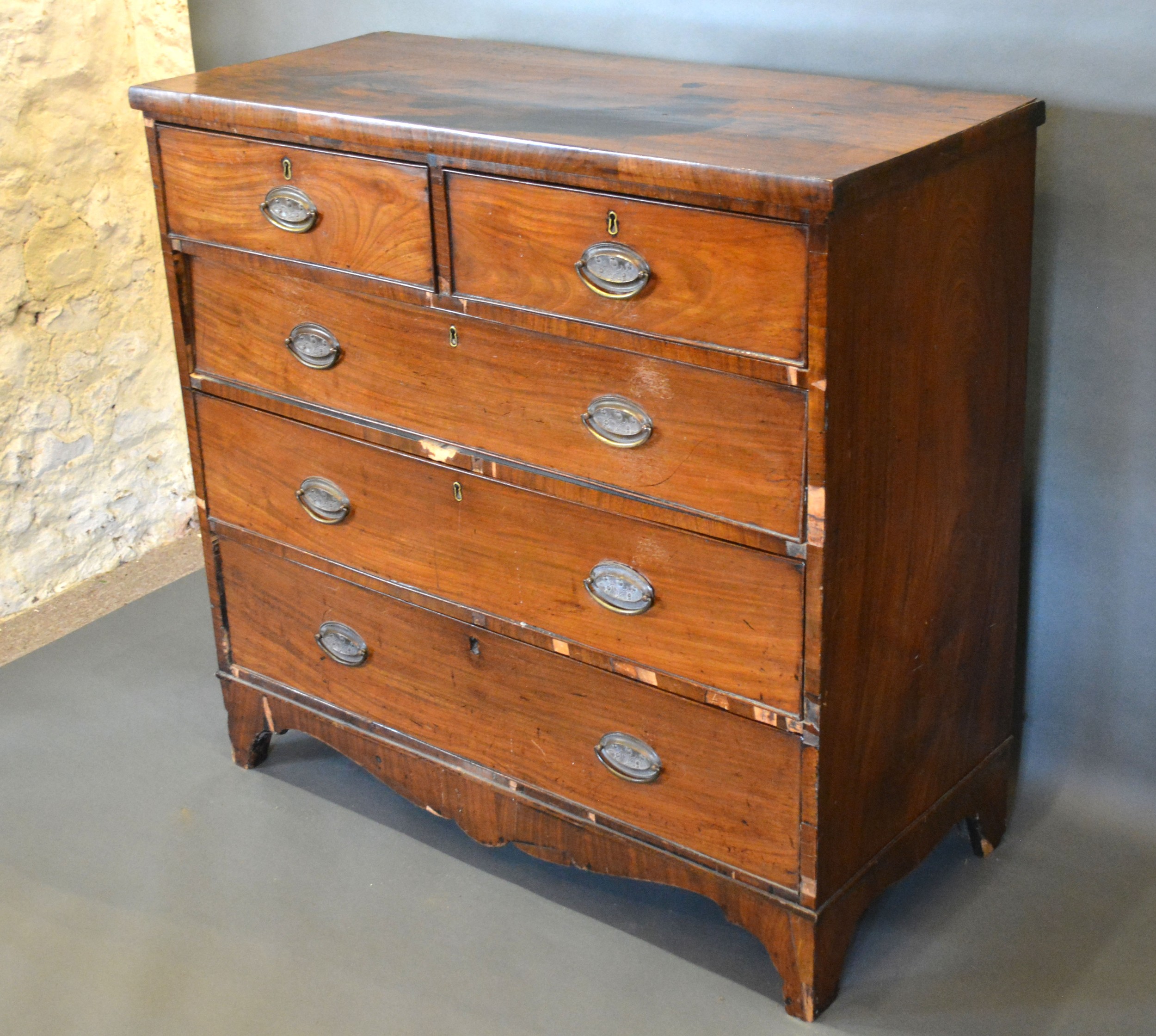 A 19th century mahogany straight front chest of two short and three long drawers with oval brass - Image 2 of 2