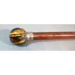 An early 20th century walking cane with Tigers Eye handle, 91cms long