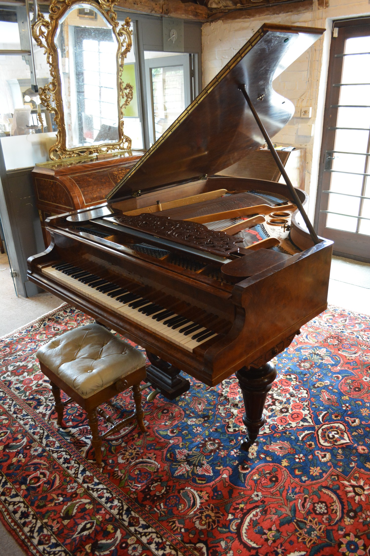 A Burr Walnut Cased Grand Piano by R Gors and Kallmann, Berlin together with a piano stool