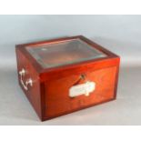 A 20th Century Collectors Cabinet, the glazed hinged top enclosing trays with end handles 30 cms