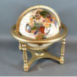 A Stone Set Globe with Brass Stand, 28 cms tall