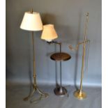 A Brass Adjustable Lamp Standard together with two other similar lamp standards