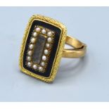 A 9ct. Gold Mourning Ring set seed pearls and enamel, ring size N, 7.2 gms.