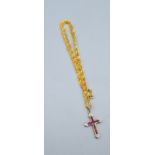 A 9ct. Gold Pendant in the form of a Crucifix set with rubies and diamonds together with a 9ct. gold