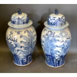 A Pair of Chinese Large Underglaze Blue Decorated Covered Vases, the covers with dogs of fo