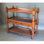 A Victorian Mahogany Buffet, the low galleried top above two central drawers with knob handles