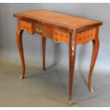 A French Inlaid and Gilt Metal Mounted Card Table of serpentine form, the hinged top enclosing a