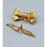 A 9ct. Gold Brooch in the form of a Bow together with another similar 9ct. gold brooch, 3.7 gms.