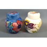 A Moorcroft Tube-lined Ginger Jar with Blue Ground 11cm tall together with a another similar